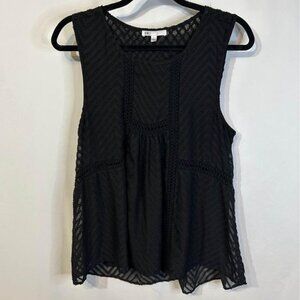 Woman’s sleeveless swing tank blouse. Size Large. Lined. Excellent condition.